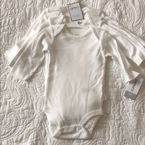 4 pack of carter’s bodysuits
